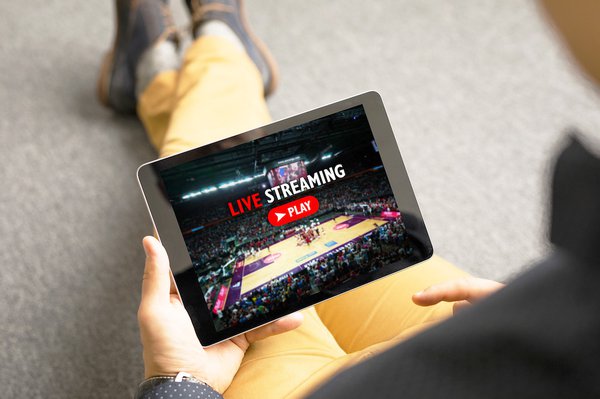 Man watching sports on live streaming online service