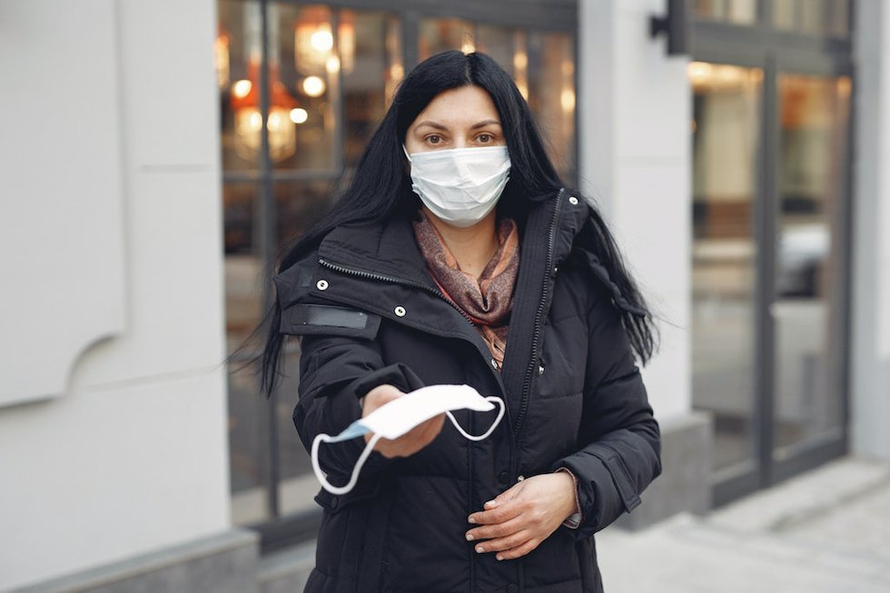 young-woman-wearing-medical-mask-and-black-down-jacket-on-3983407.jpg.jpe