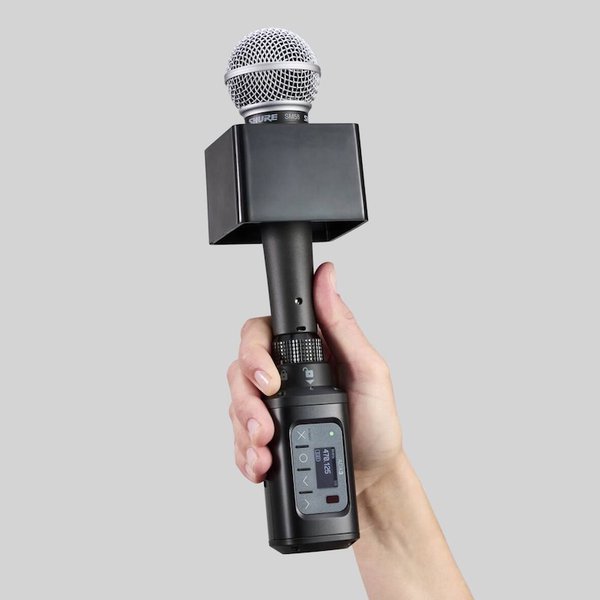 Shure ADX3 with hand.jpg